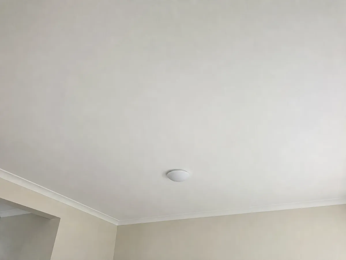 Freshly completed seamless plaster ceiling repair