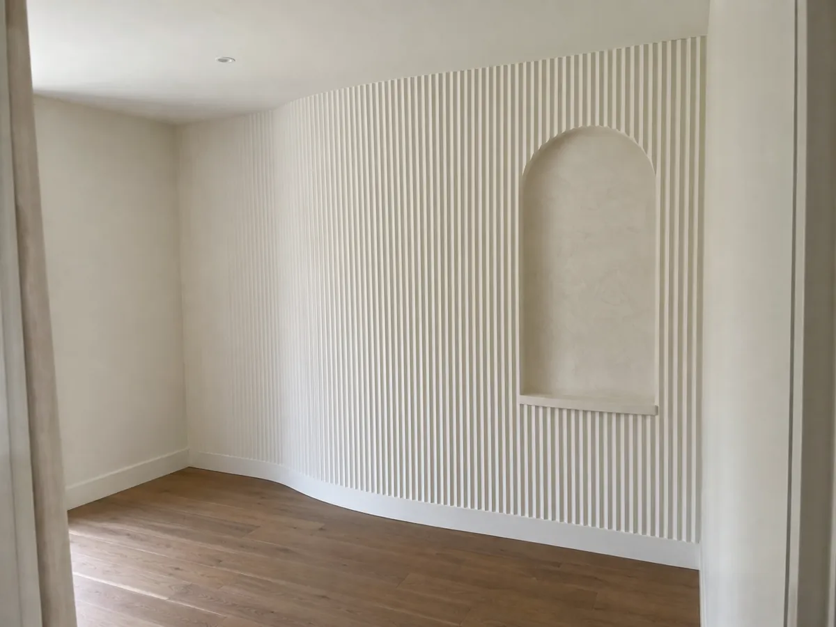 Completed fluted plaster feature wall and arched niche
