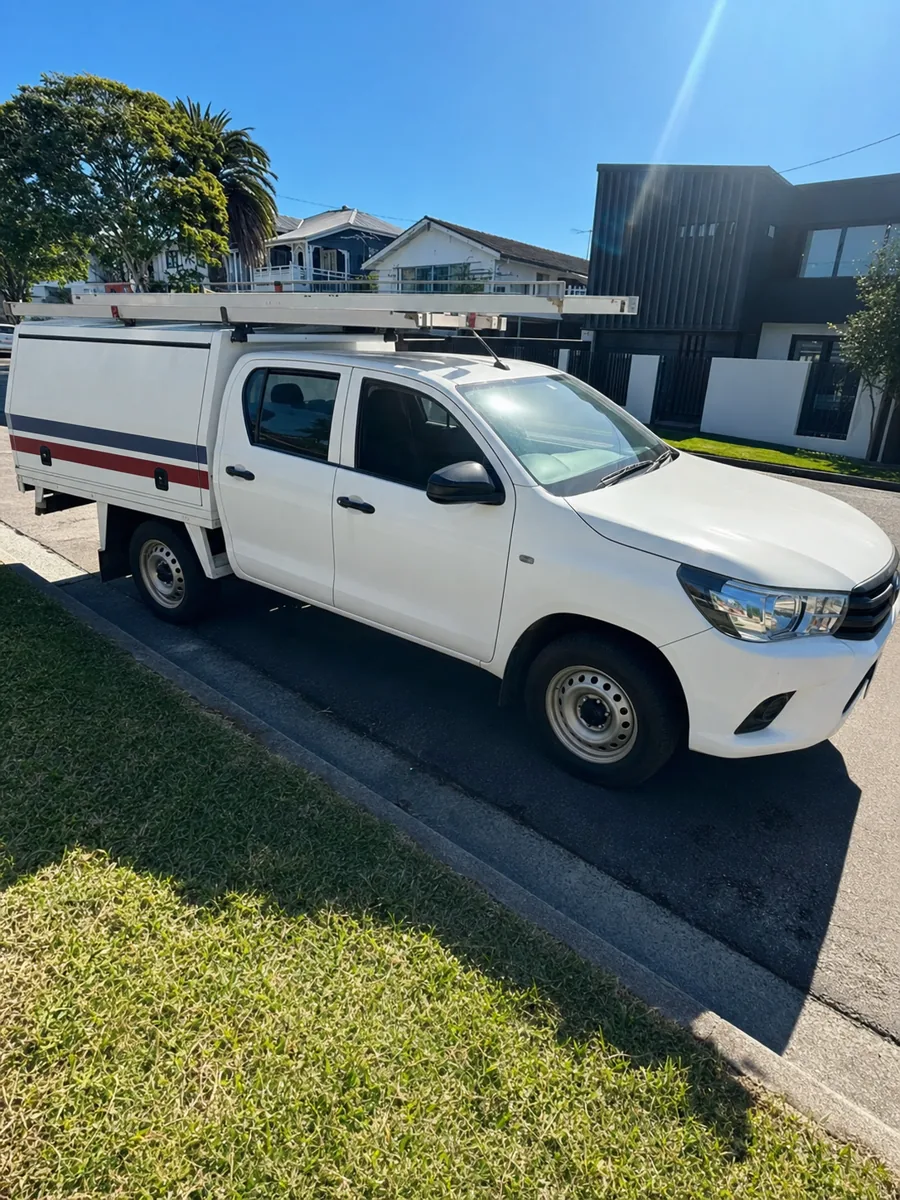 Professional plastering ute parked on a Brisbane suburban street